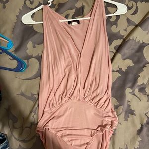 Baby pink body suit